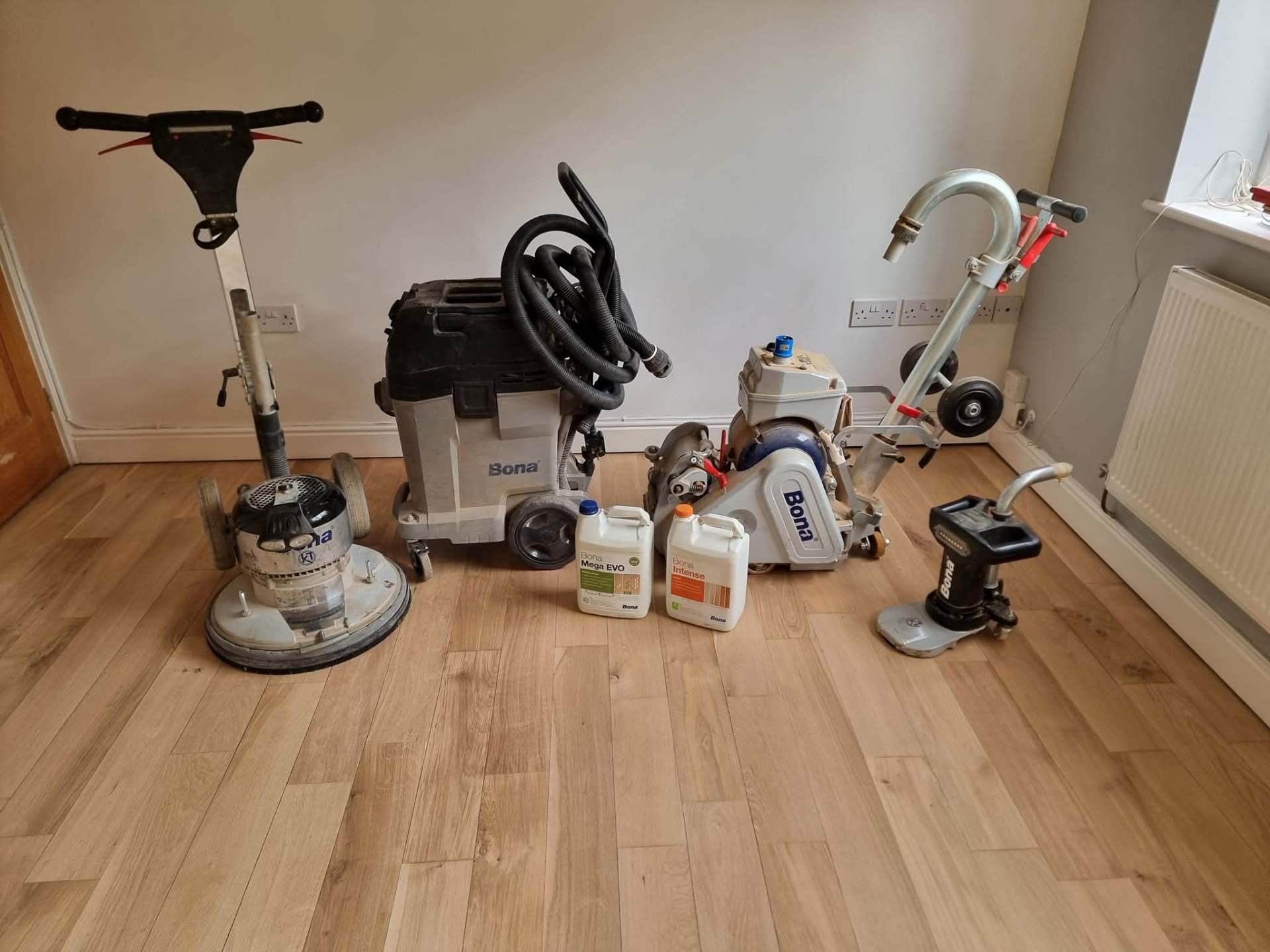 Professional Bona floor sanding and polishing equipment on oak flooring