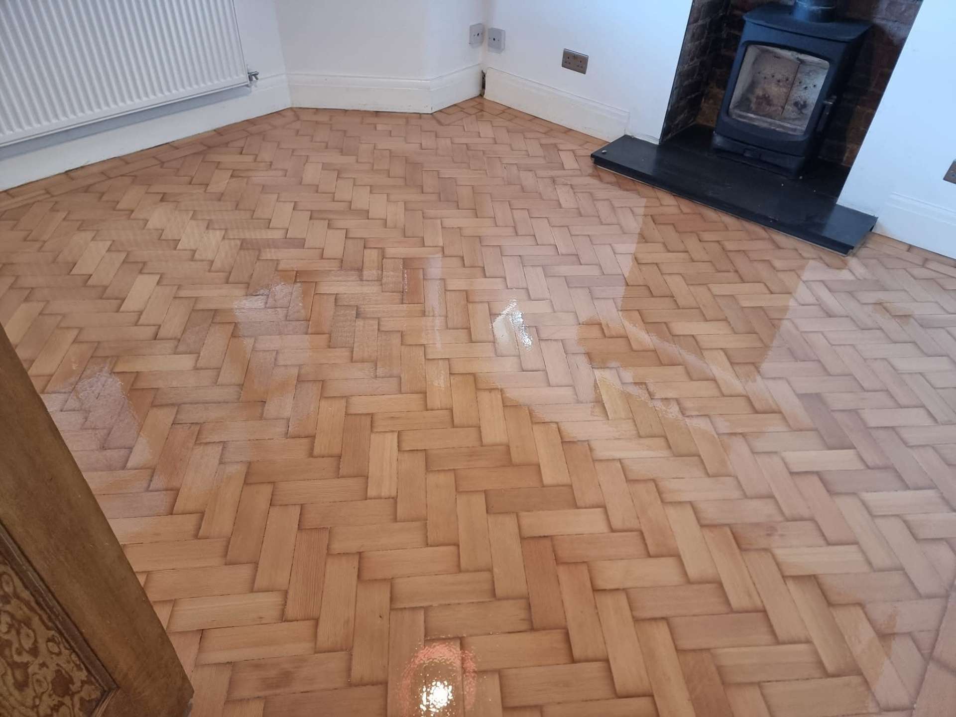 Herringbone parquet floor with fresh lacquer finish