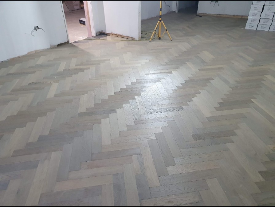 Herringbone flooring installation photo 4